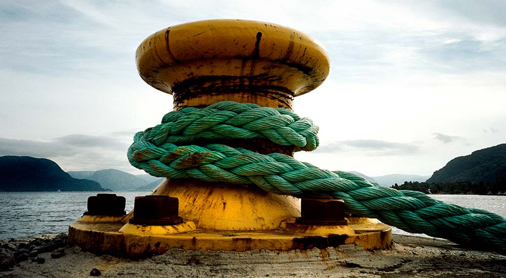 Ship rope tied to a pier.